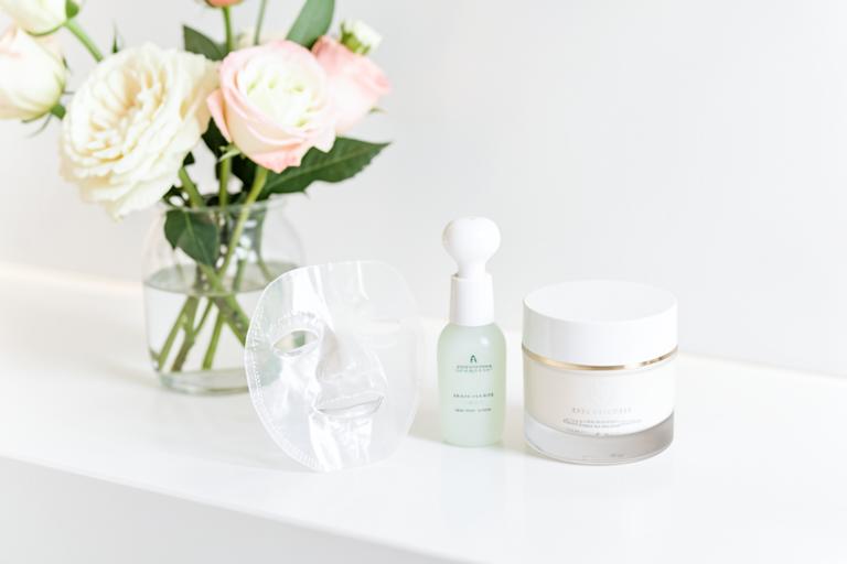 Sheet mask, jade roller and moisturiser used at the end of the facial